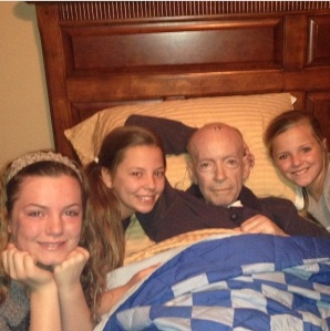 My three girls and their grandad in his final hours.